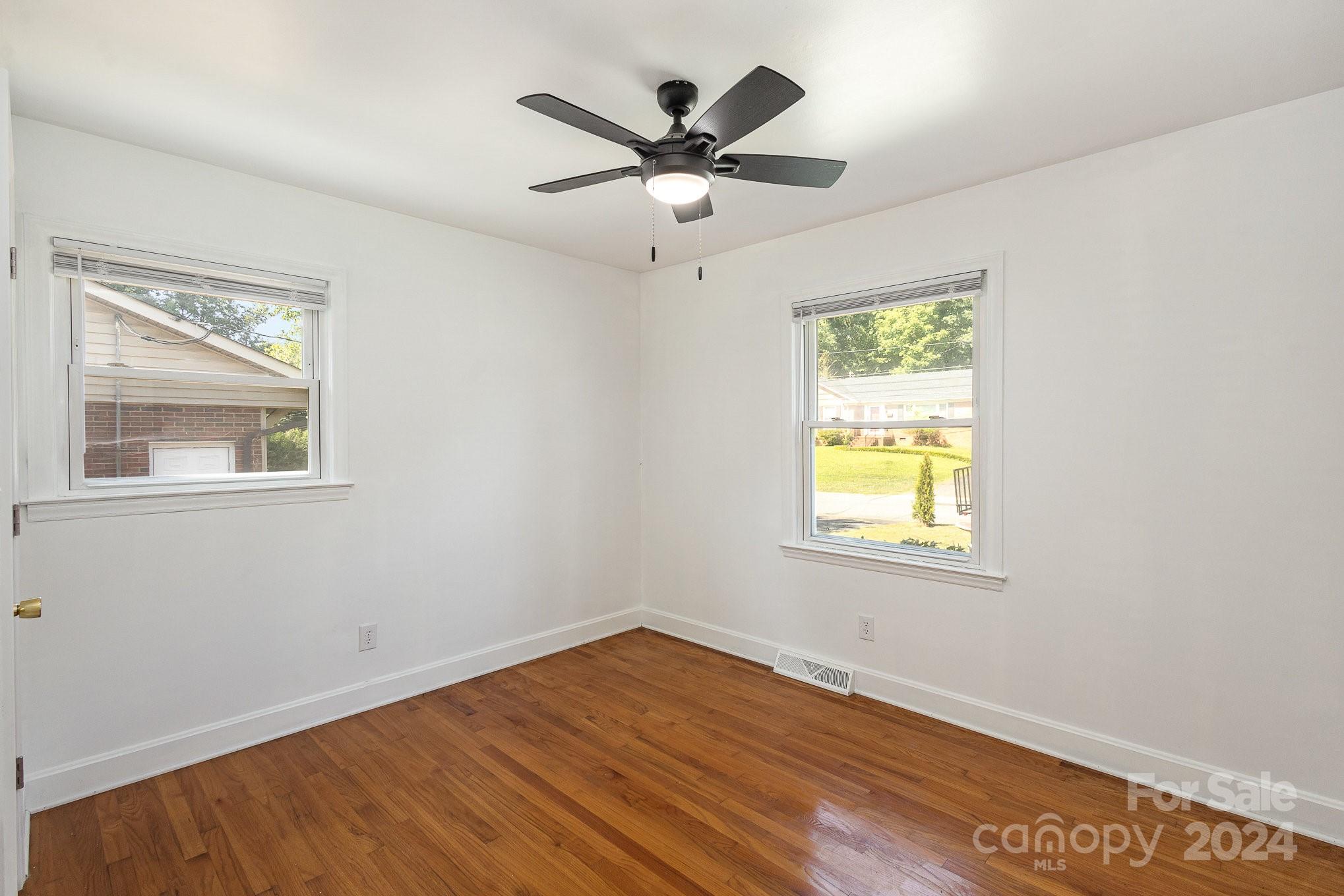 4431 Westridge Drive Charlotte, NC 28208 - Photo 17 of 24 wooden floor in an empty room with a window