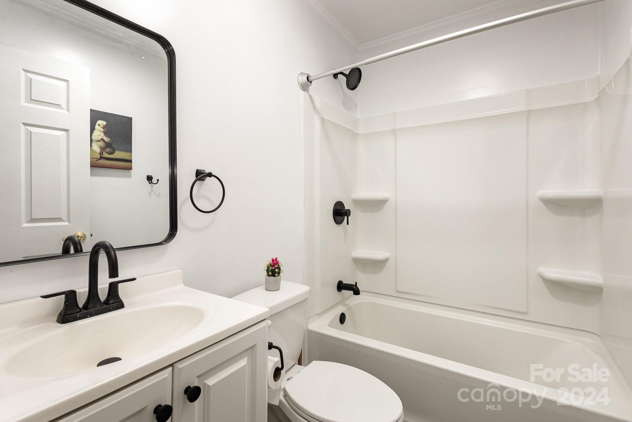 4431 Westridge Drive Charlotte, NC 28208 - Photo 18 of 24 a bathroom with a sink and a mirror