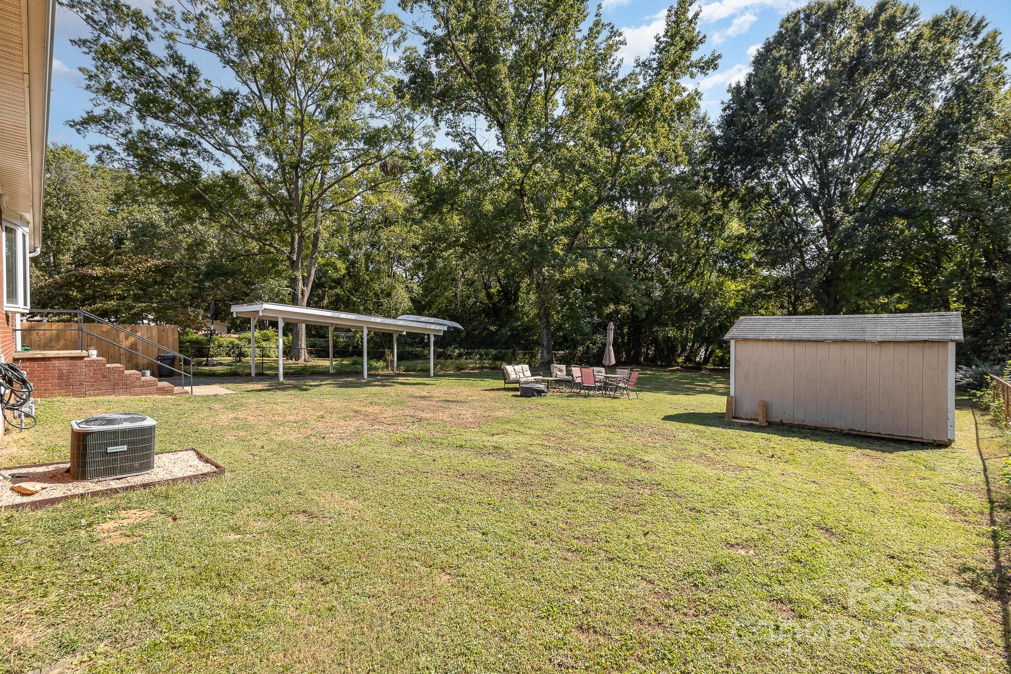 4431 Westridge Drive Charlotte, NC 28208 - Photo 19 of 24 a swimming pool with porch and furniture