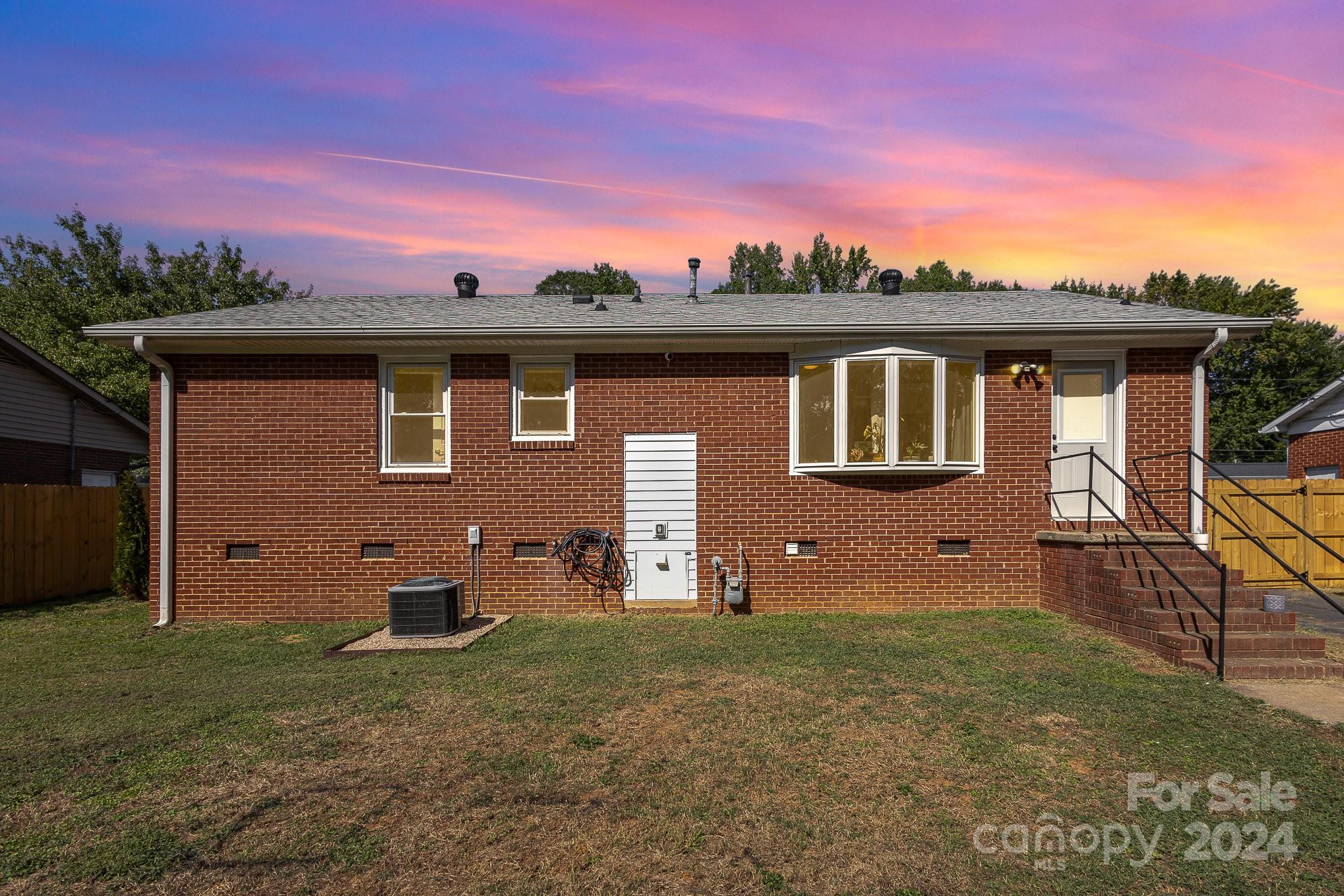 4431 Westridge Drive Charlotte, NC 28208 - Photo 20 of 24 a front view of a house with a yard