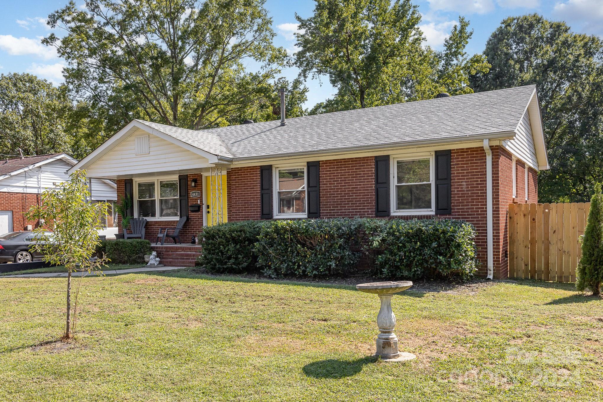4431 Westridge Drive Charlotte, NC 28208 - Photo 2 of 24 a front view of a house with garden