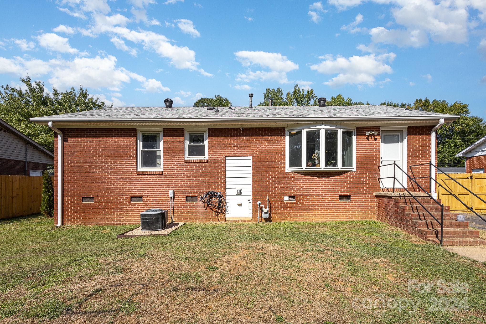 4431 Westridge Drive Charlotte, NC 28208 - Photo 21 of 24 a front view of a house with garden