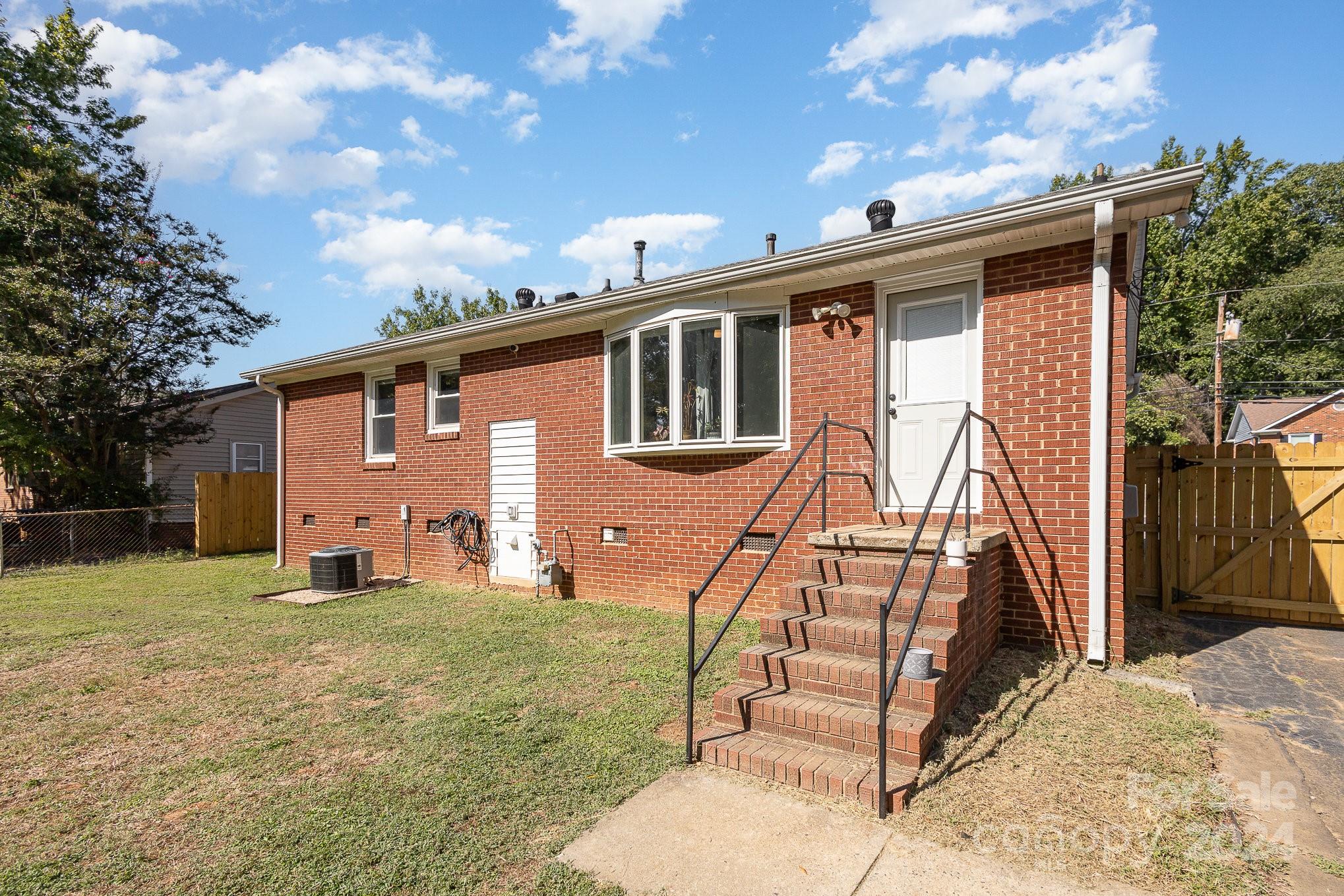 4431 Westridge Drive Charlotte, NC 28208 - Photo 22 of 24 a front view of house with a garden