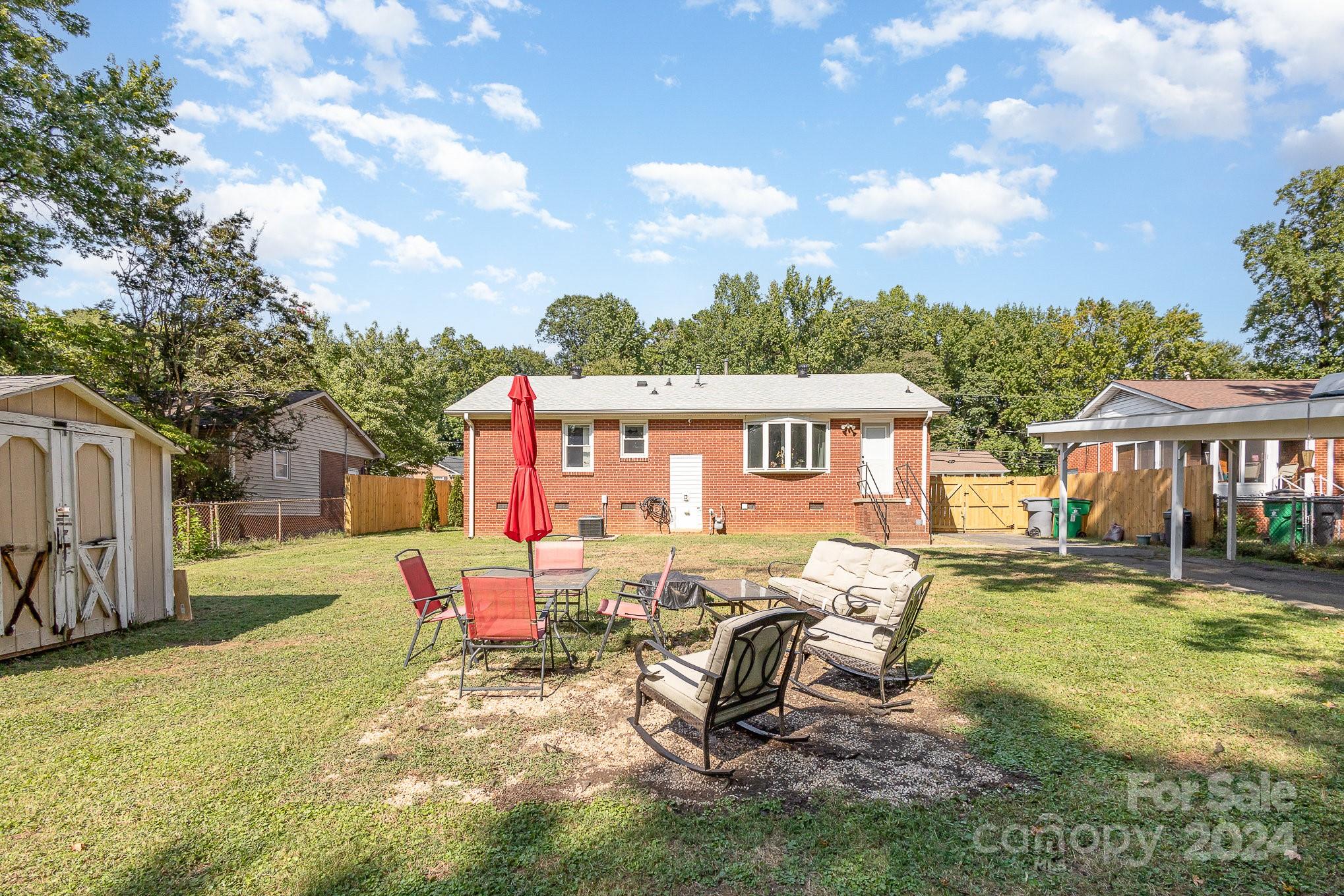 4431 Westridge Drive Charlotte, NC 28208 - Photo 23 of 24 a view of a house with backyard and sitting area