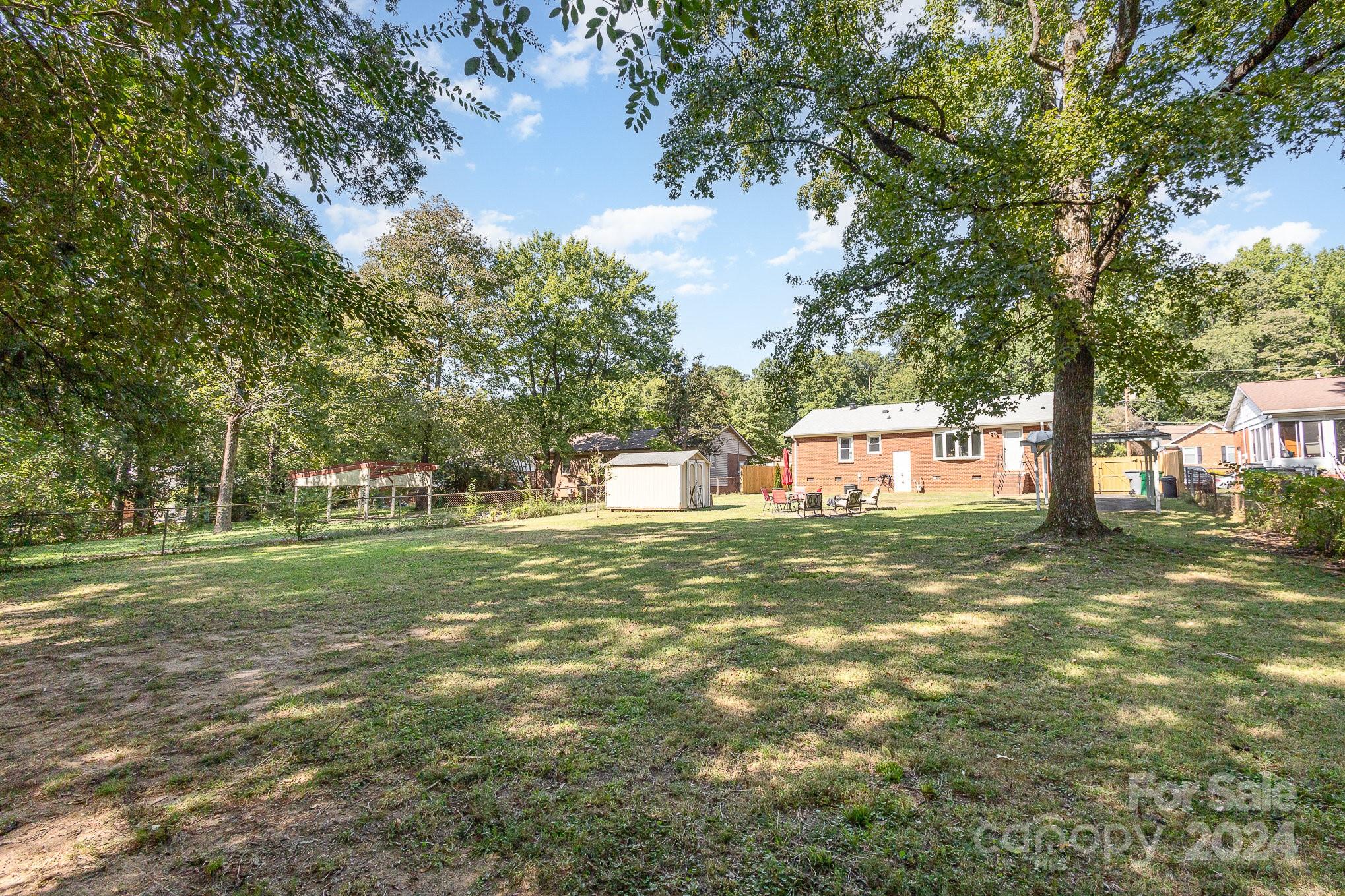 4431 Westridge Drive Charlotte, NC 28208 - Photo 24 of 24 a front view of a house with a garden