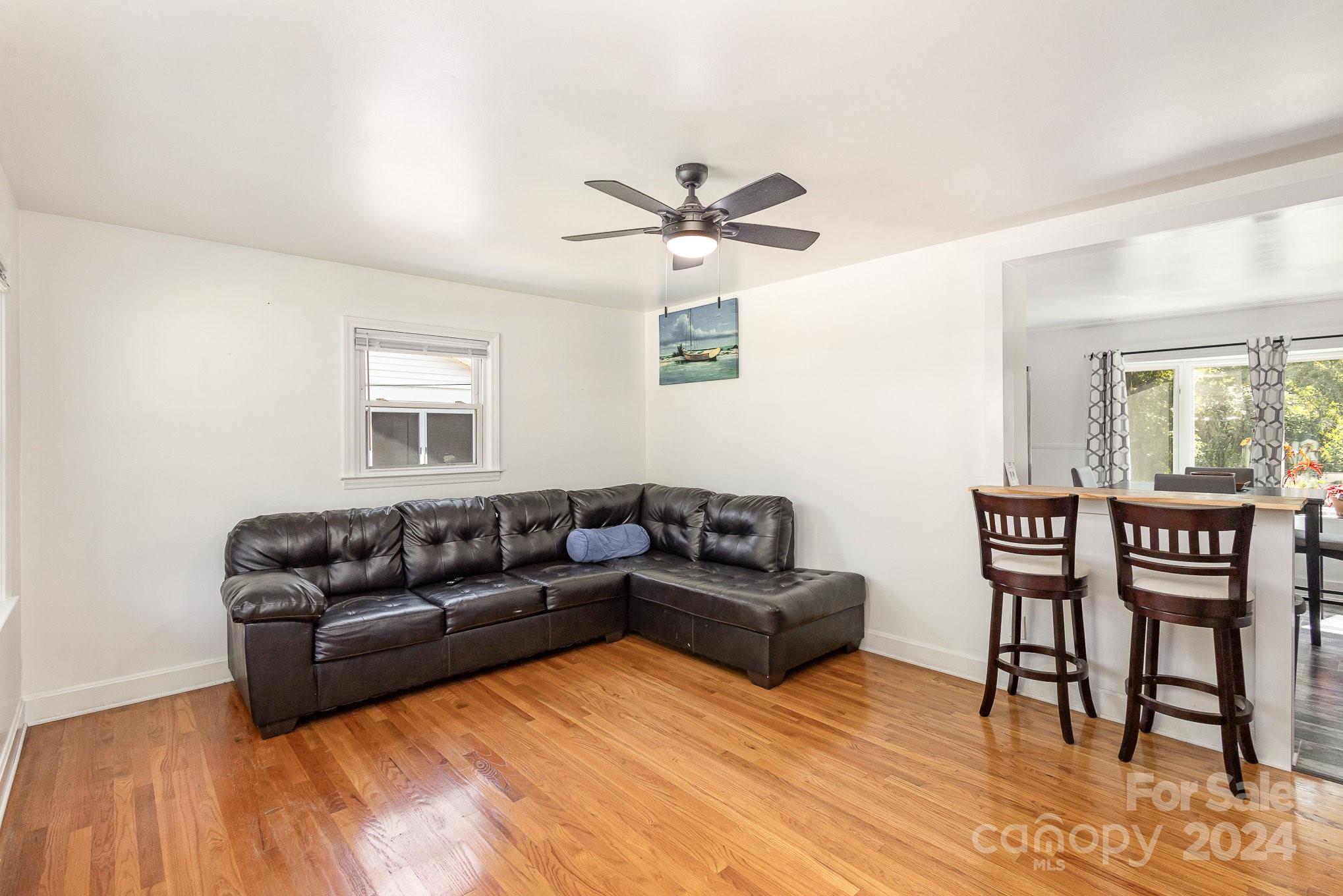 4431 Westridge Drive Charlotte, NC 28208 - Photo 3 of 24 a living room with furniture and a wooden floor