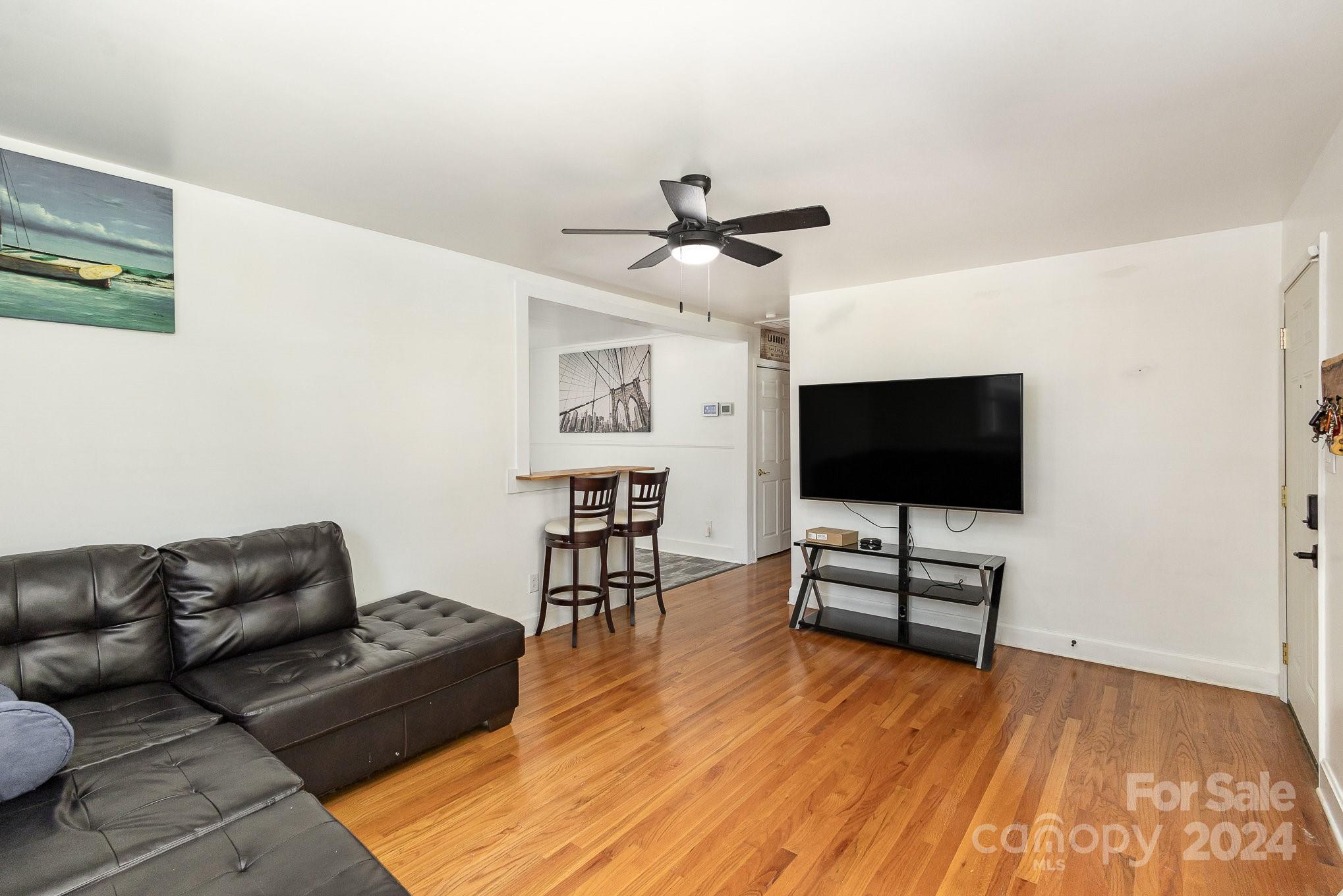 4431 Westridge Drive Charlotte, NC 28208 - Photo 4 of 24 a living room with furniture and a flat screen tv