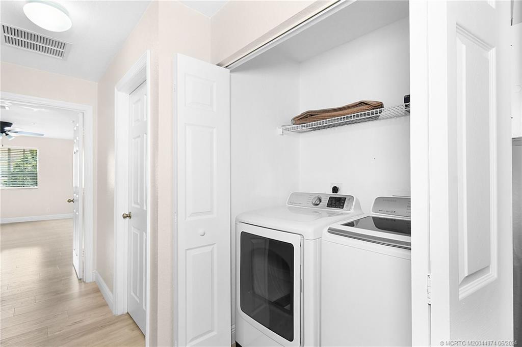 365 Southeast Bloxham Way Stuart, FL 34997 - Photo 15 of 27 a storage room with washer and dryer