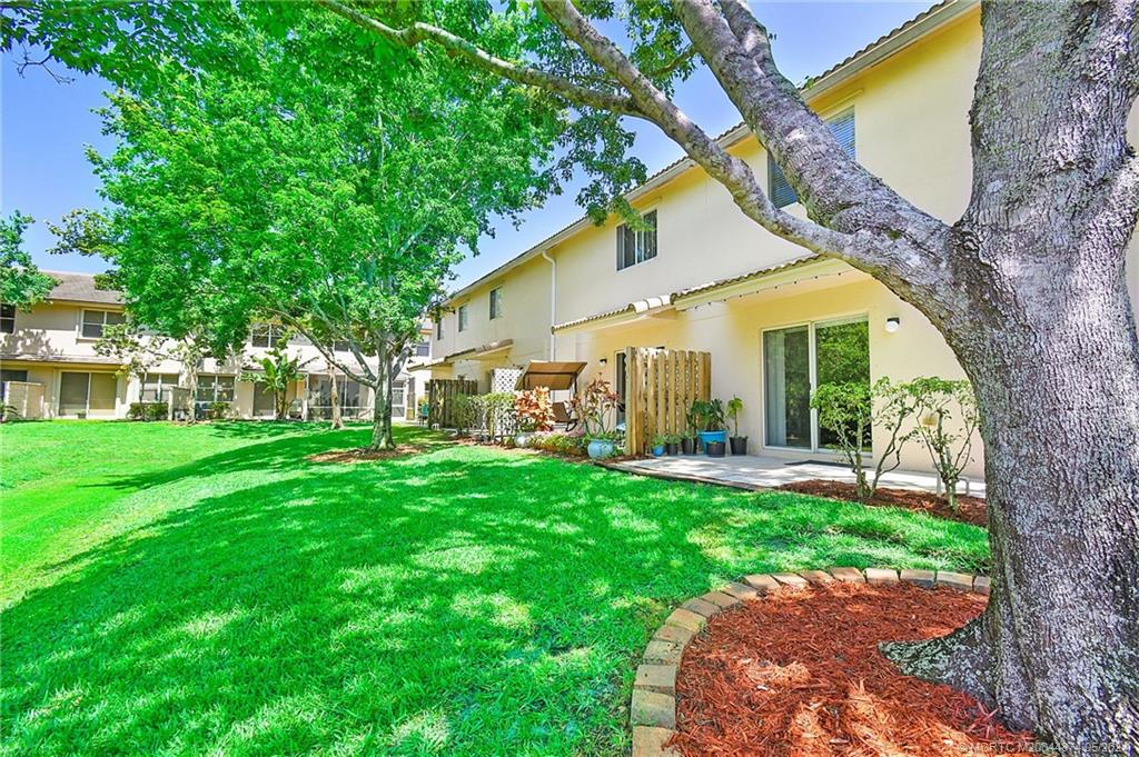 365 Southeast Bloxham Way Stuart, FL 34997 - Photo 22 of 27 a view of a yard in front of house