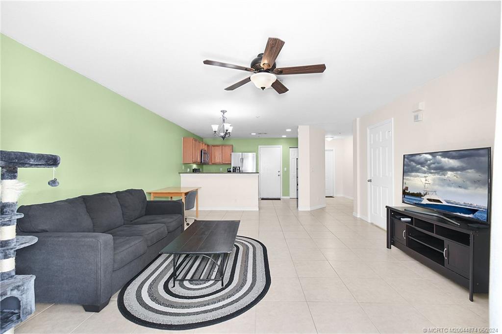 365 Southeast Bloxham Way Stuart, FL 34997 - Photo 3 of 27 a living room with furniture and a flat screen tv
