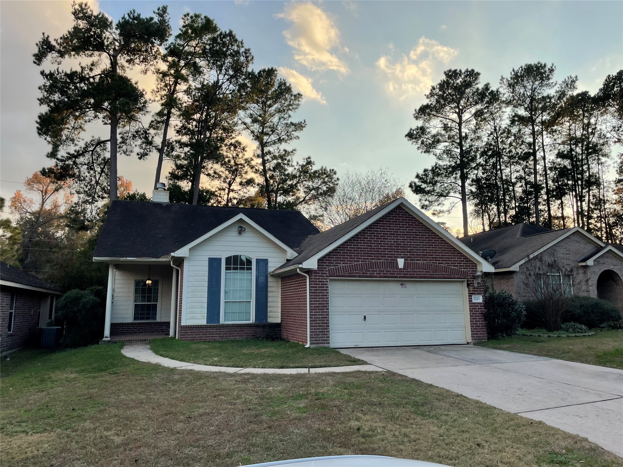 2223 Trey Rogillios Way Conroe, TX 77304 - Photo 1 of 10 a front view of a house with a garden