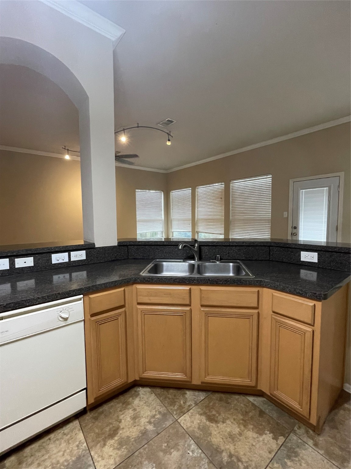 2223 Trey Rogillios Way Conroe, TX 77304 - Photo 4 of 10 a large kitchen with a sink and cabinets