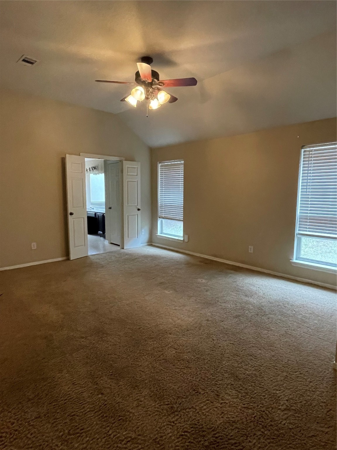 2223 Trey Rogillios Way Conroe, TX 77304 - Photo 8 of 10 a view of an empty room with a chandelier fan
