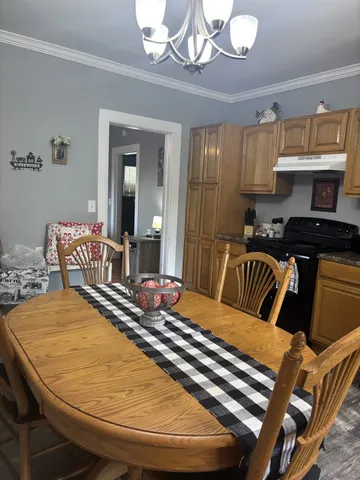 a bedroom with a bed and lamp