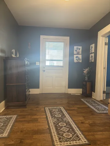 a view of a room with a wooden floor