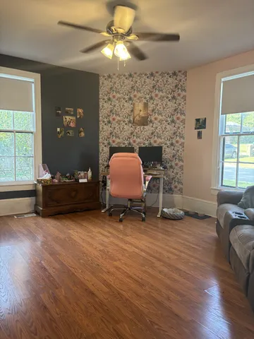 a living room with furniture and a fireplace