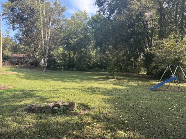 a view of a swimming pool with an outdoor space