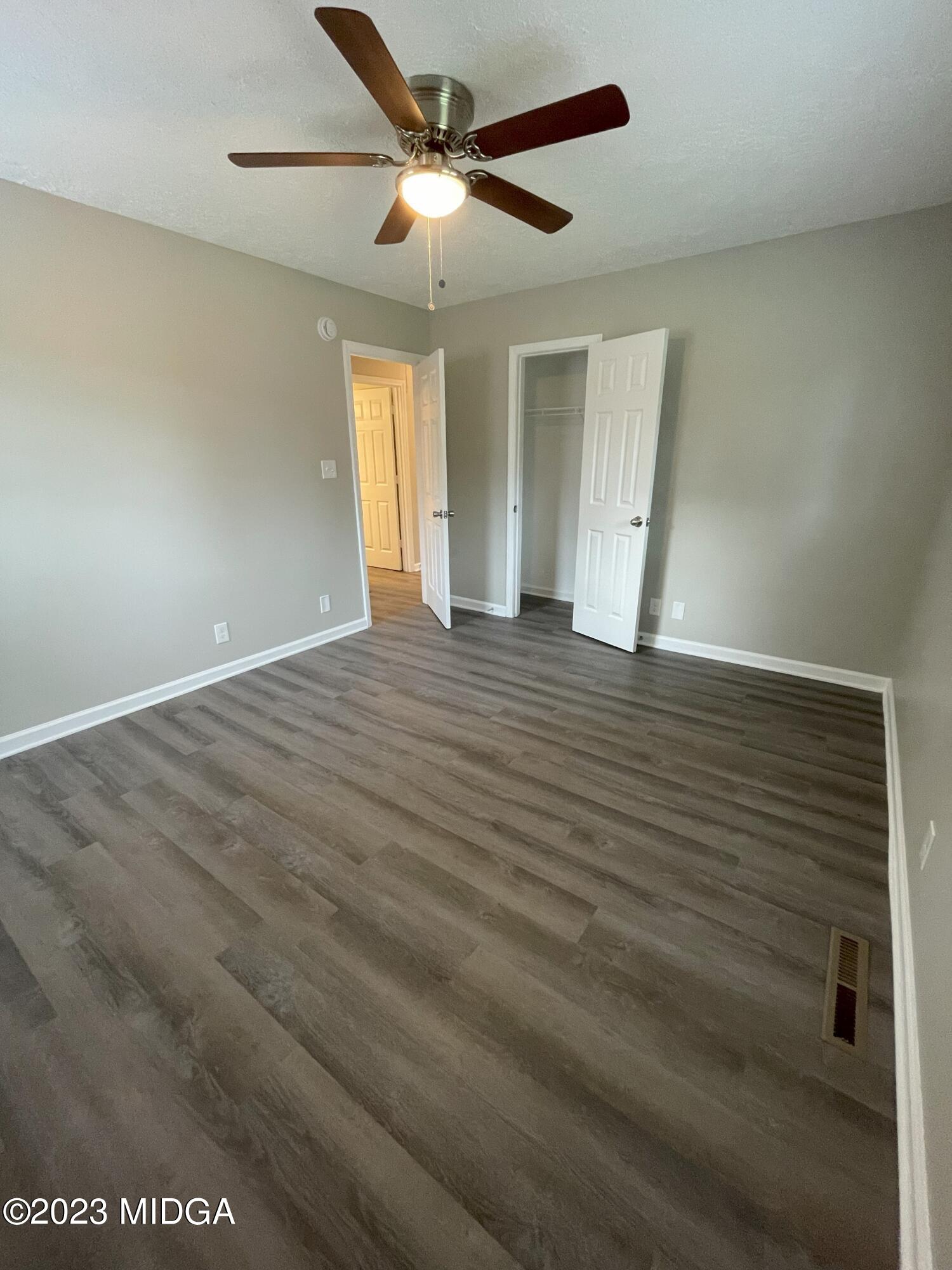 1437 Canterbury Road Macon, GA 31206 - Photo 15 of 18 wooden floor in an empty room