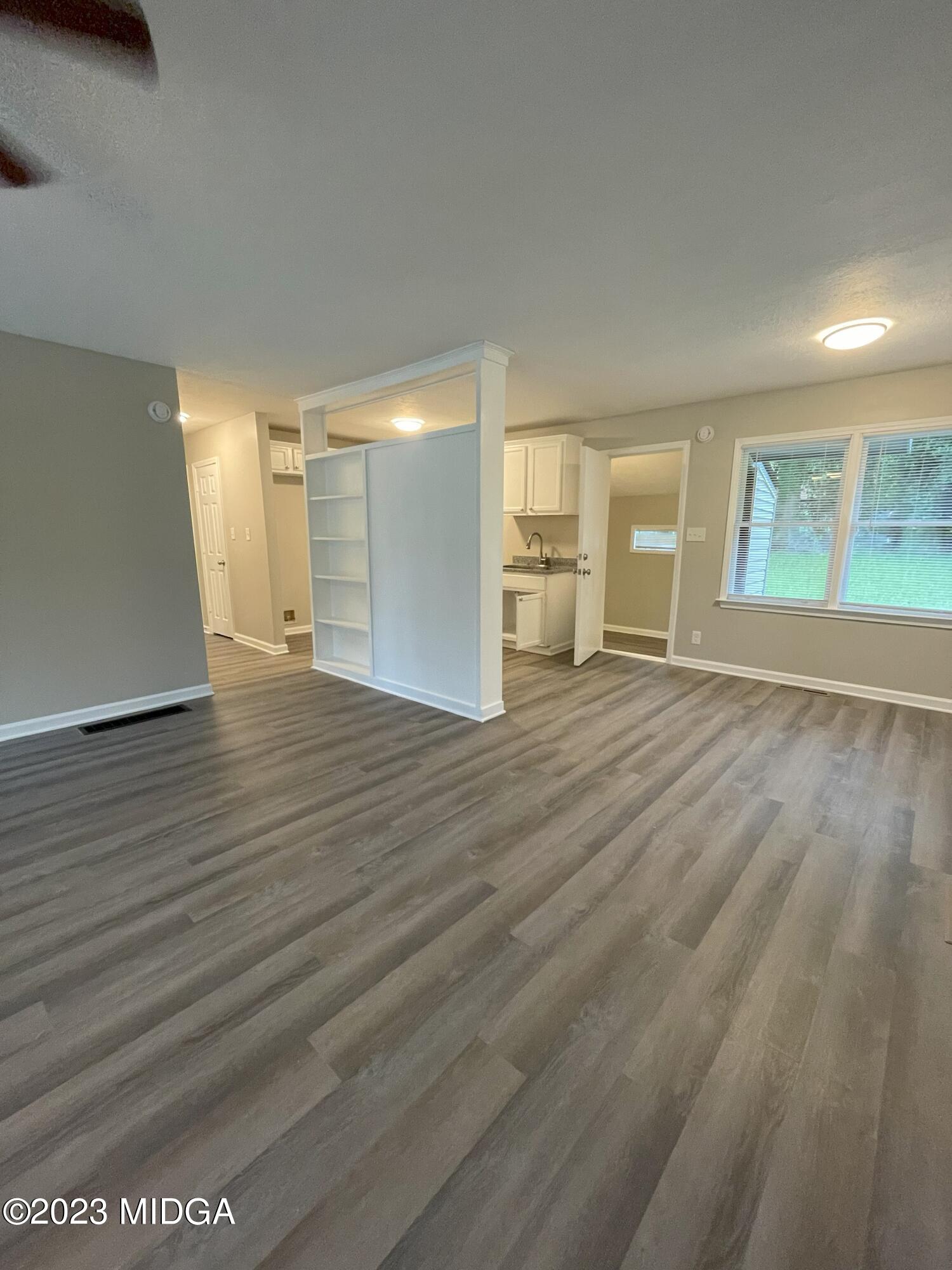 1437 Canterbury Road Macon, GA 31206 - Photo 3 of 18 a view of a livingroom with wooden floor