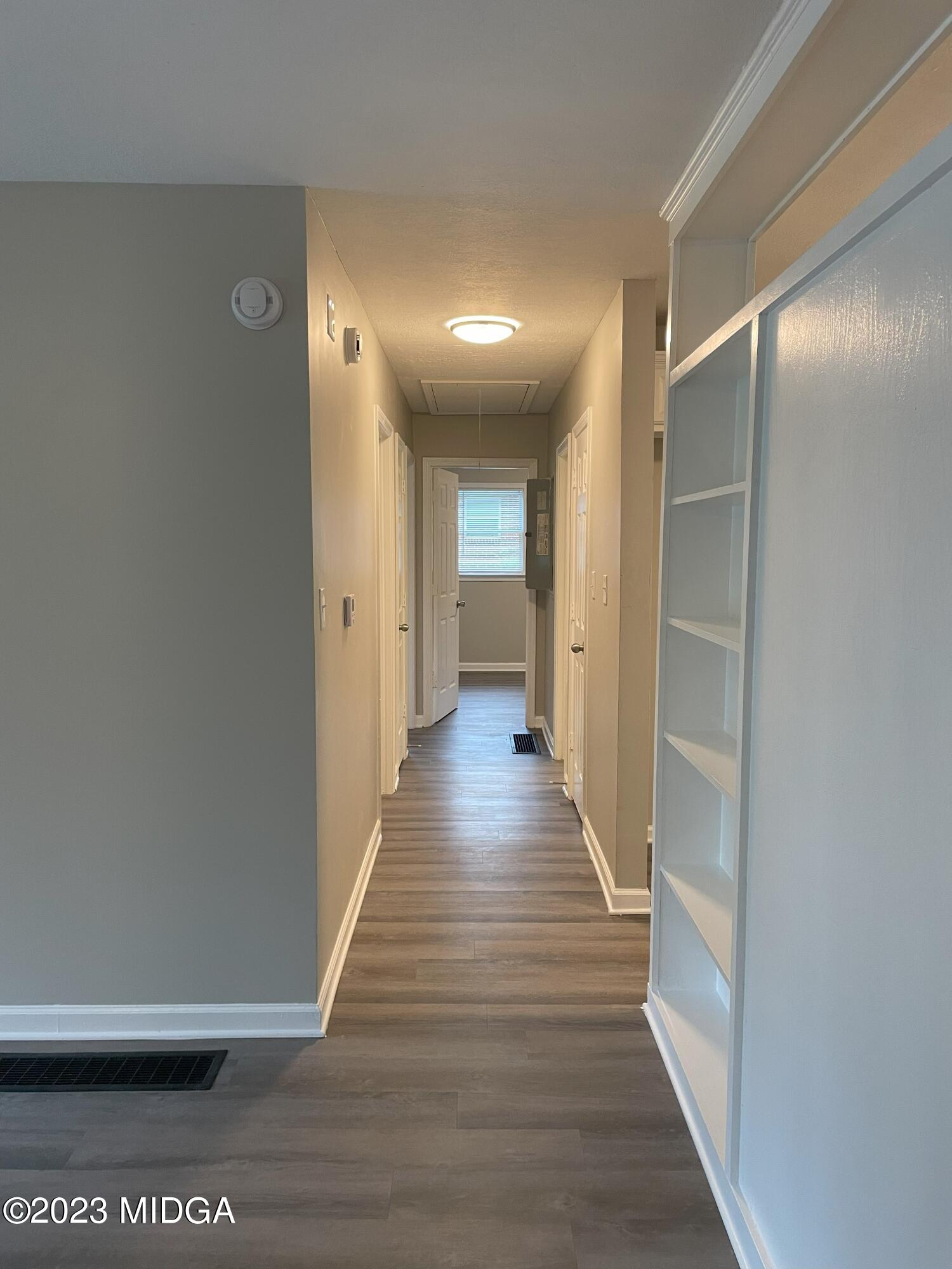 1437 Canterbury Road Macon, GA 31206 - Photo 9 of 18 a view of a hallway with wooden floor