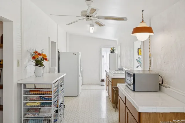 a bedroom with furniture and a chandelier