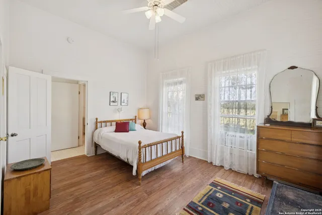 a room with a table chairs and a sink