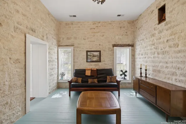 a living room with furniture and a rug