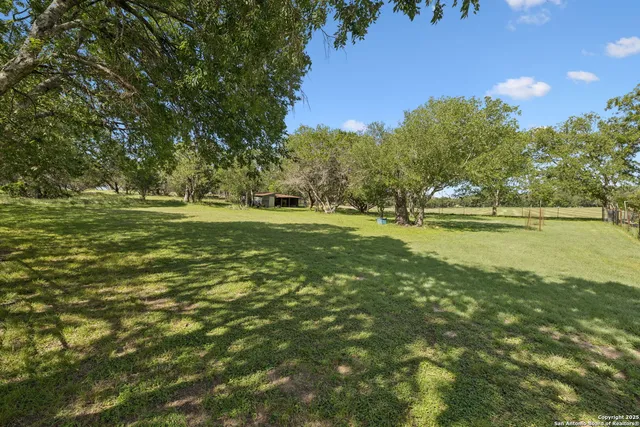 a view of outdoor space with deck and yard
