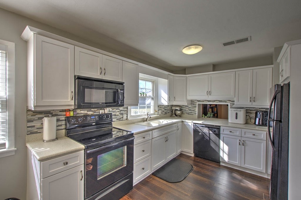 2261 Hoyt Court Decatur, IL 62526 - Photo 10 of 26 a kitchen with a sink stove cabinets and refrigerator