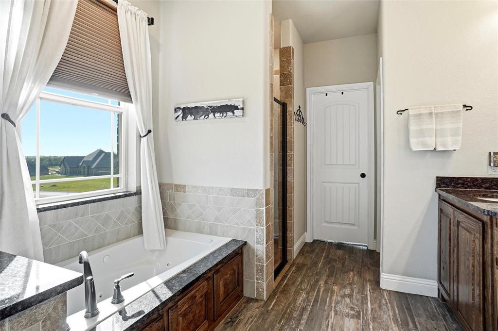 1024 Tex Lane Springtown, TX 76082 - Photo 23 of 40 a bathroom with a sink and a mirror