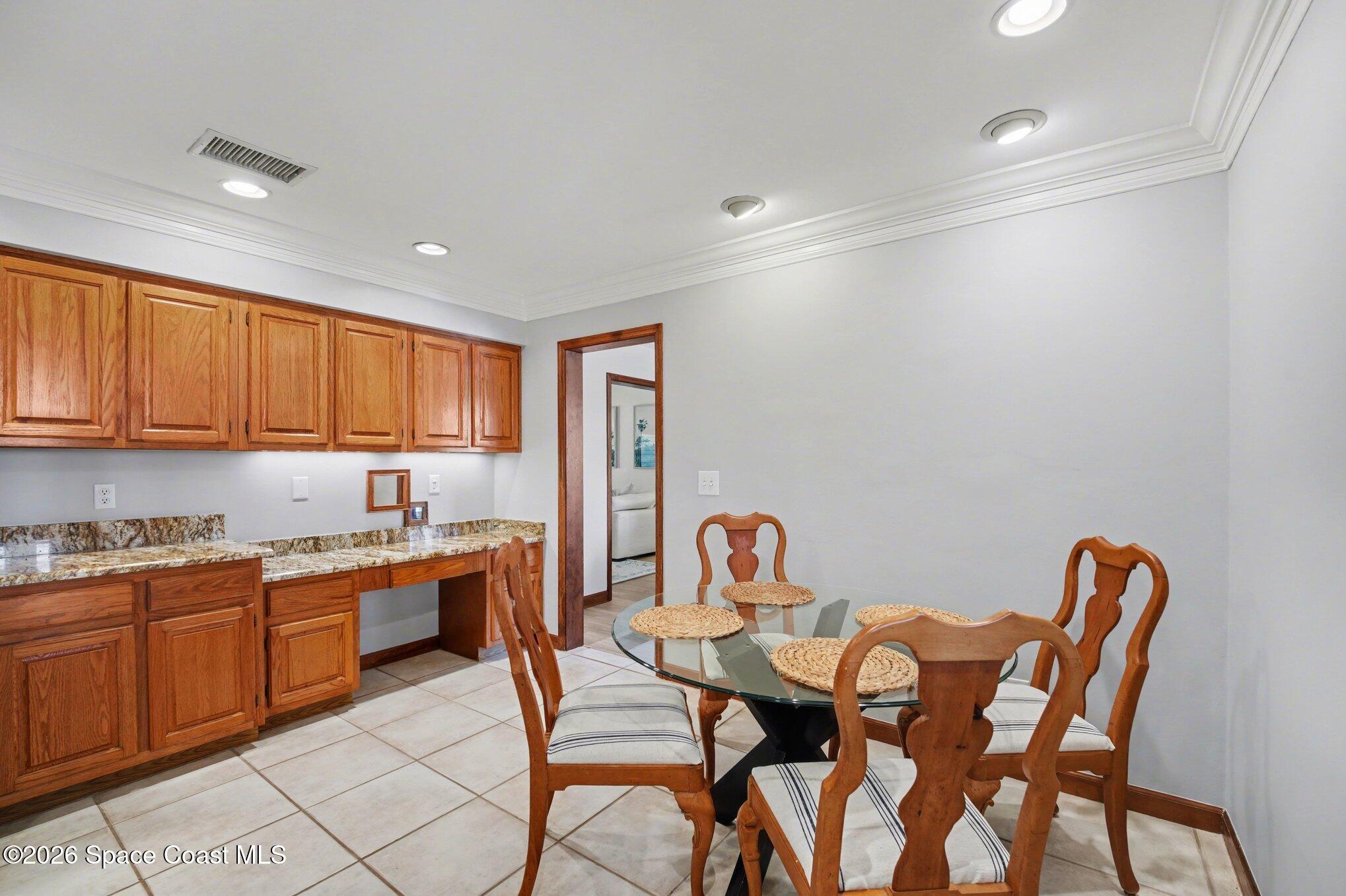 568 Rio Casa Drive North Indialantic, FL 32903 - Photo 11 of 45 a view of a dining room with furniture and a kitchen