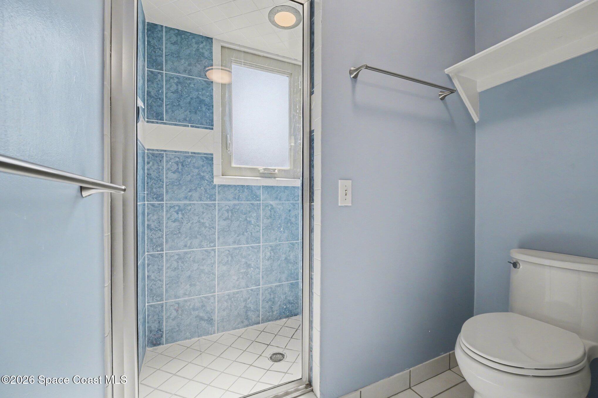 568 Rio Casa Drive North Indialantic, FL 32903 - Photo 16 of 45 a bathroom with a shower and toilet