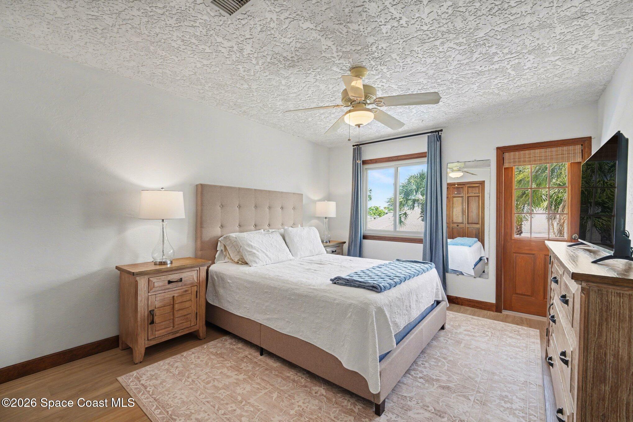568 Rio Casa Drive North Indialantic, FL 32903 - Photo 18 of 45 a bedroom with a large bed and a window