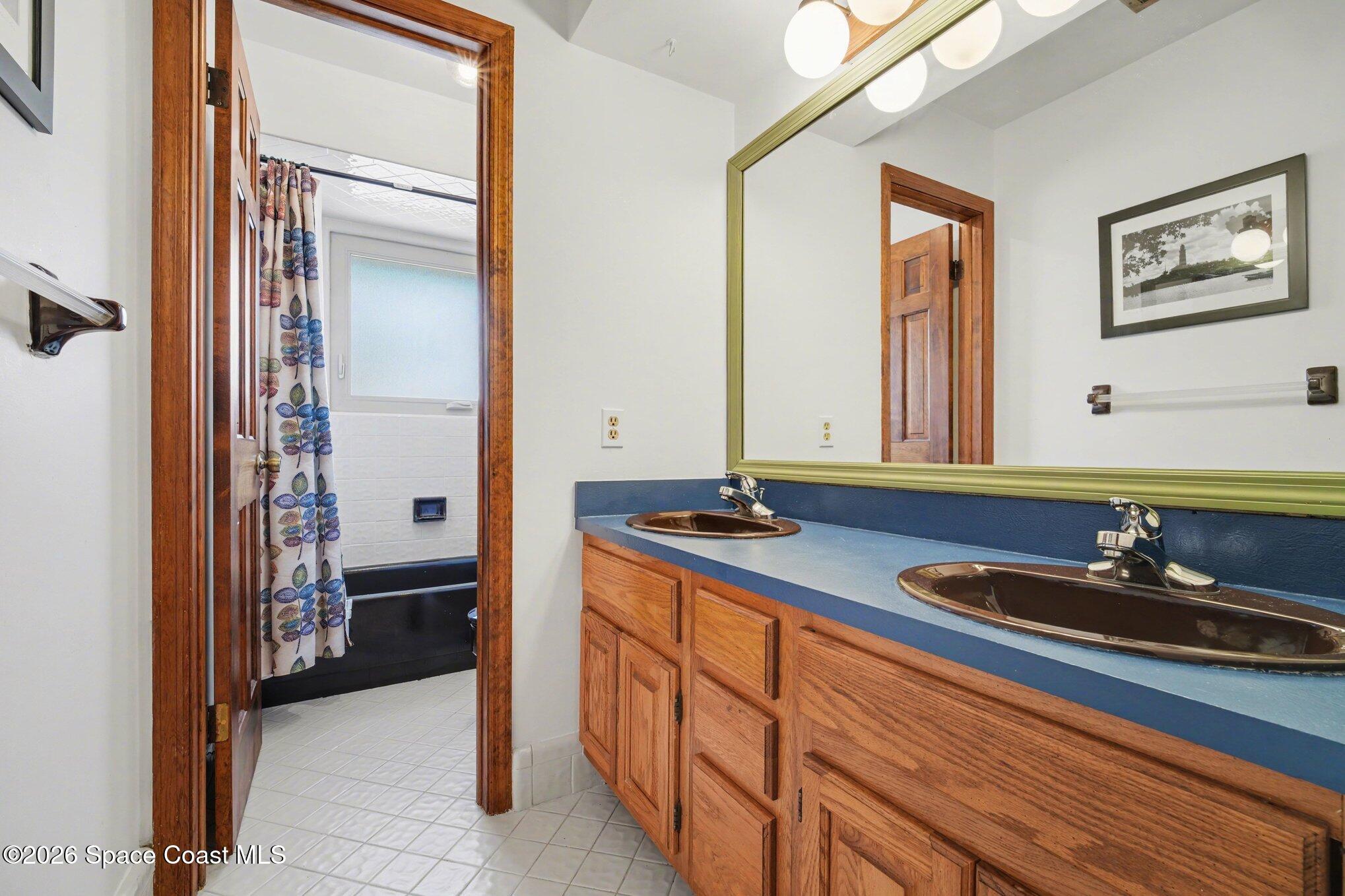 568 Rio Casa Drive North Indialantic, FL 32903 - Photo 22 of 45 a bathroom with a sink and a mirror