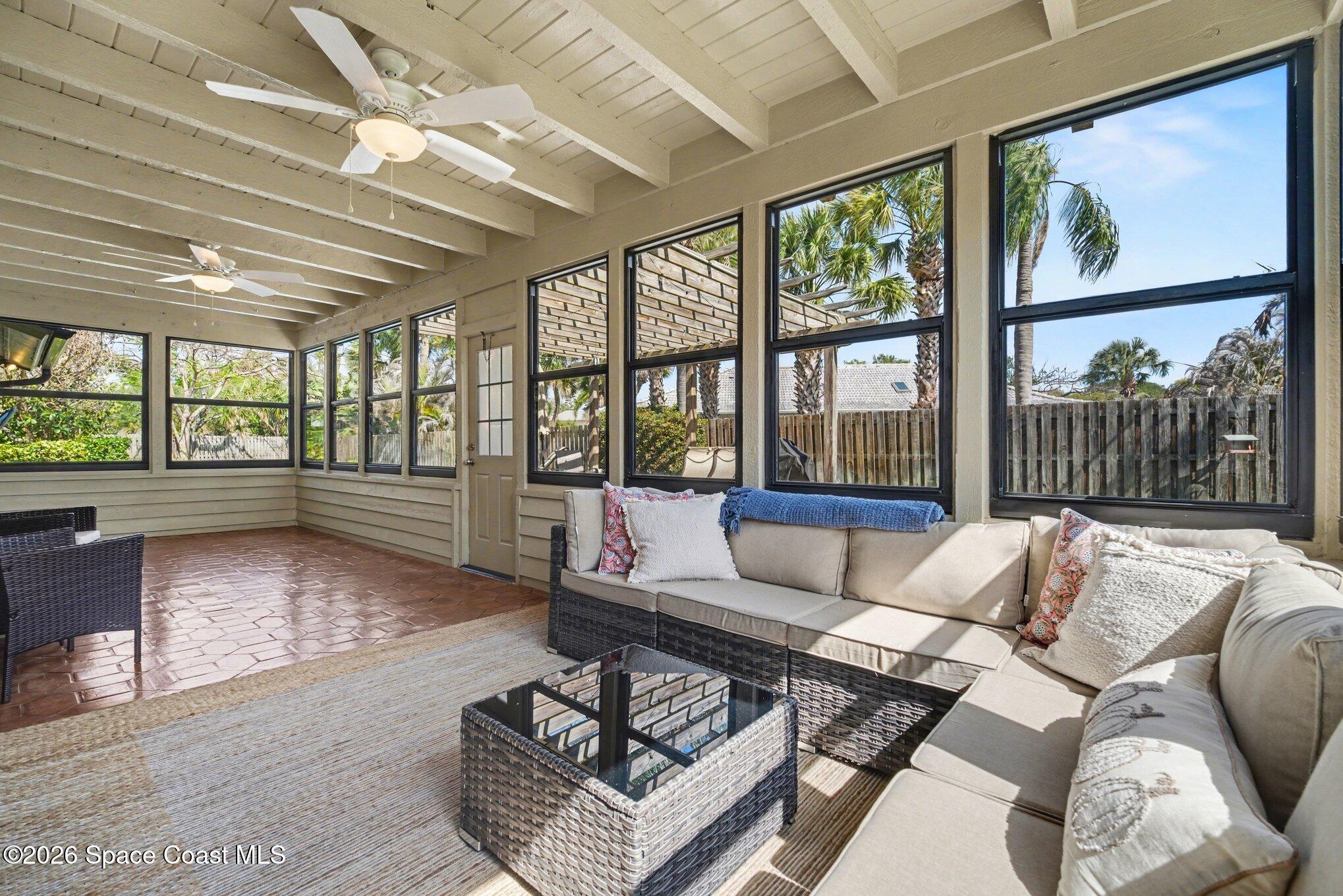 568 Rio Casa Drive North Indialantic, FL 32903 - Photo 32 of 45 a living room with furniture and a large window