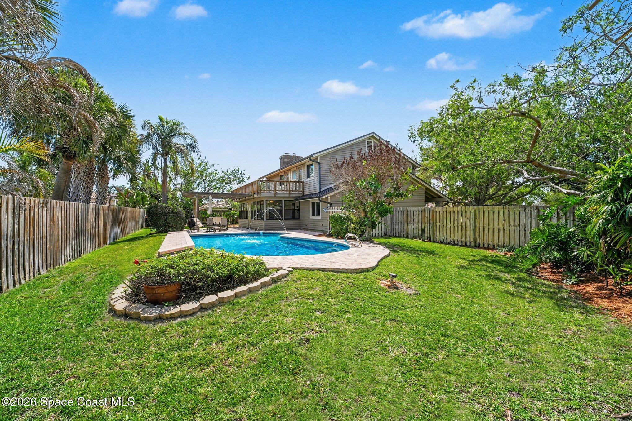 568 Rio Casa Drive North Indialantic, FL 32903 - Photo 37 of 45 a view of a backyard with wooden fence