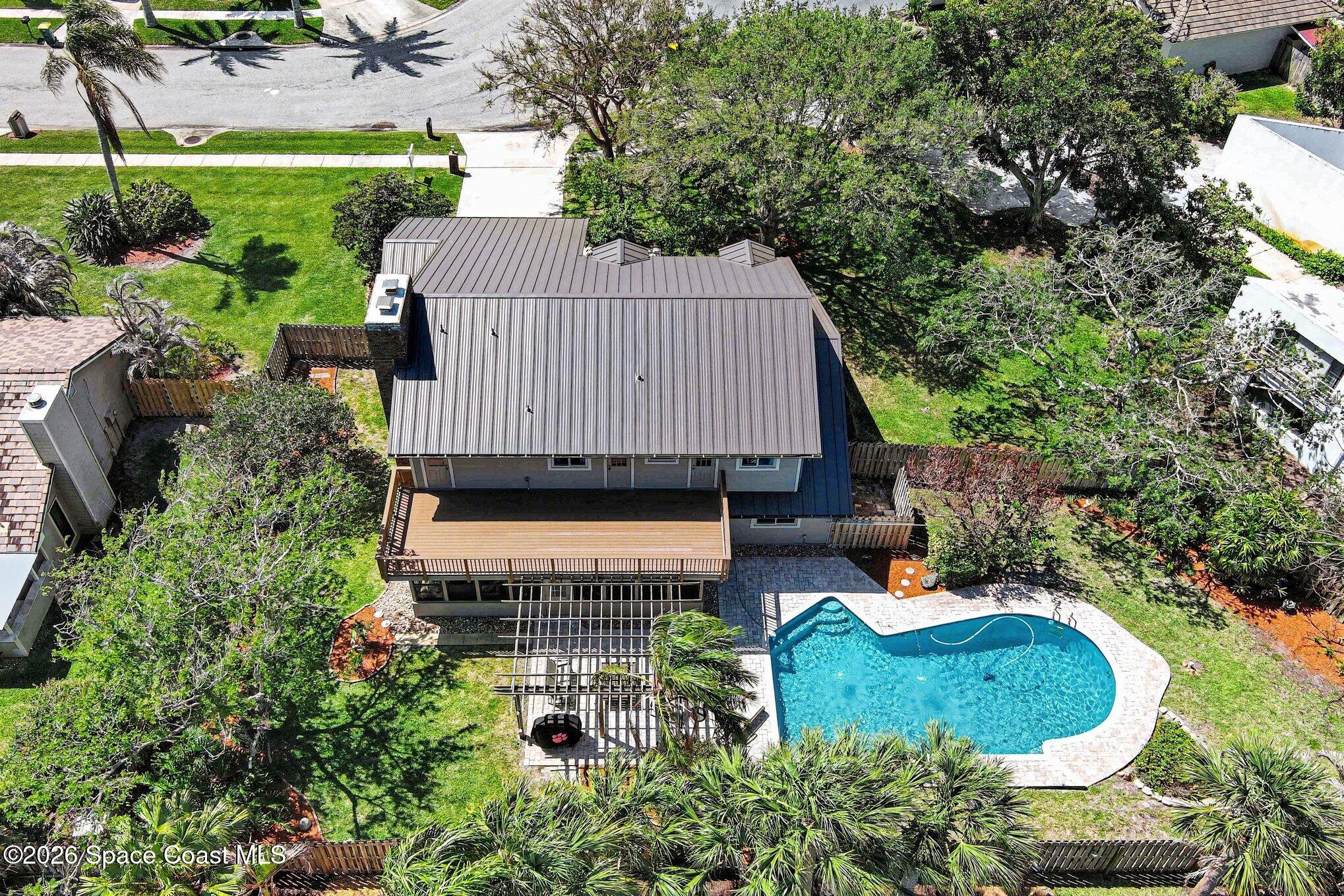 568 Rio Casa Drive North Indialantic, FL 32903 - Photo 39 of 45 an aerial view of a house with garden space and outdoor seating