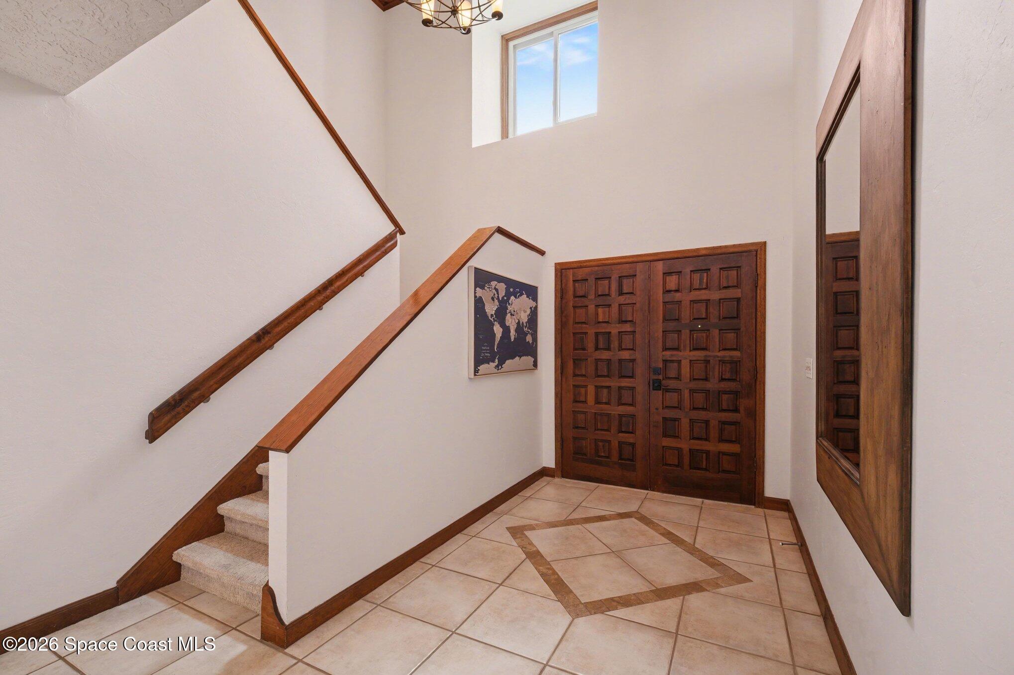 568 Rio Casa Drive North Indialantic, FL 32903 - Photo 4 of 45 a view of an entryway with stairs