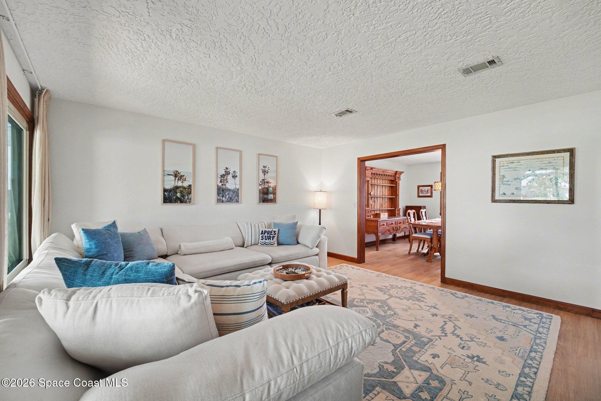 568 Rio Casa Drive North Indialantic, FL 32903 - Photo 5 of 45 a living room with furniture and a couch