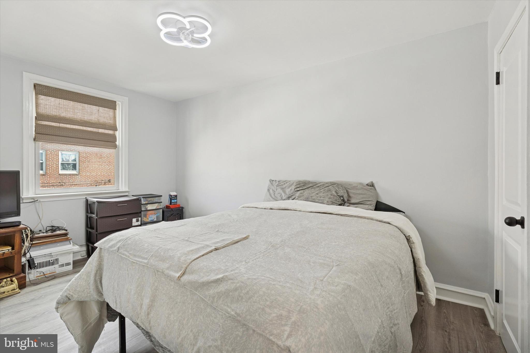 8259 Williams Avenue Philadelphia, PA 19150 - Photo 16 of 25 a bedroom with a bed and a table