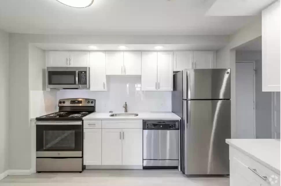 2 Ocean, Unit 402 Revere, MA 02151 - Photo 2 of 16 a kitchen with stainless steel appliances a refrigerator stove and microwave
