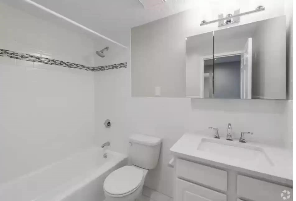 2 Ocean, Unit 402 Revere, MA 02151 - Photo 8 of 16 a bathroom with a sink a toilet and shower