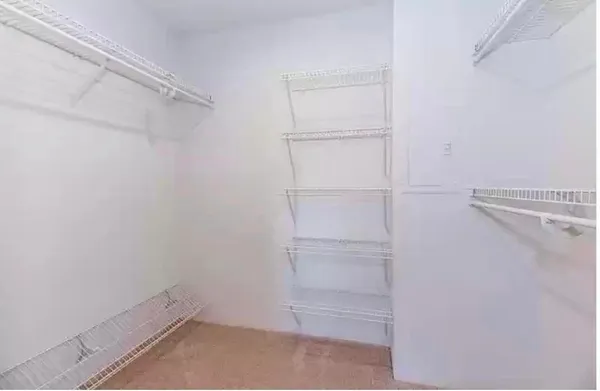 a view of an empty walk in closet