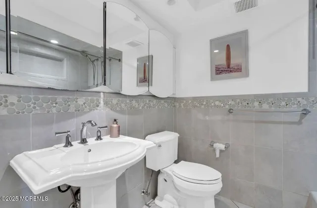 a bathroom with a shower and a toilet