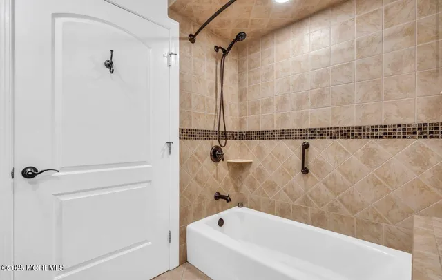 a bathroom with a granite countertop sink a toilet and a mirror