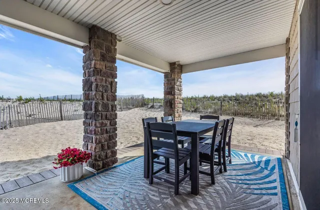 a view of a brick house with a yard