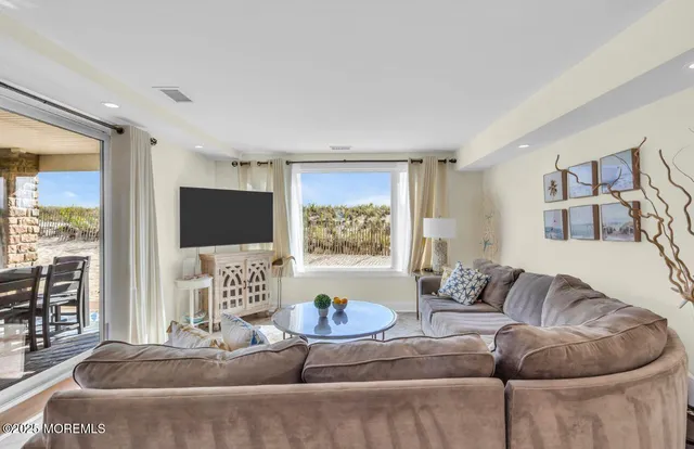 a living room with furniture and a view of living room