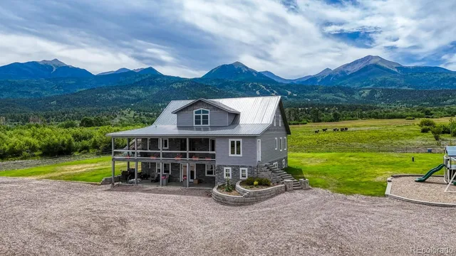 an aerial view of a house with outdoor space