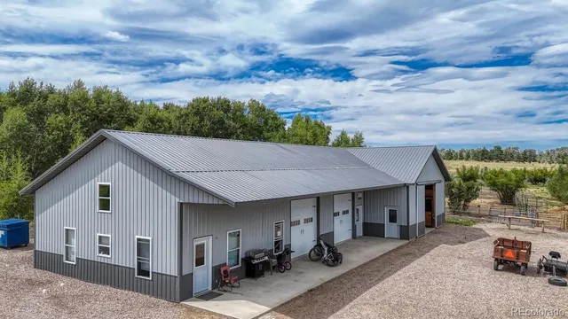 a aerial view of a house with sitting area