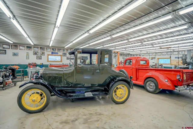 a car and bike parked in a room